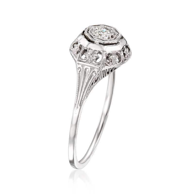 White gold diamond cluster ring with octagonal center stone and openwork side details