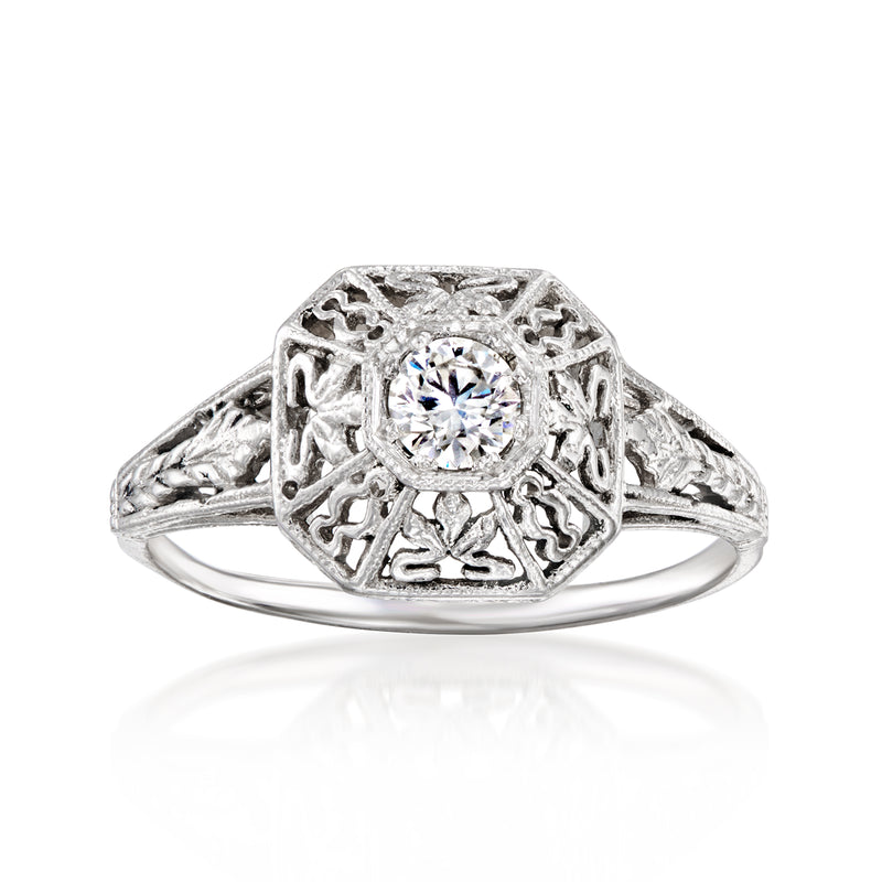 Vintage openwork diamond ring in 14kt white gold with round center stone and filigree