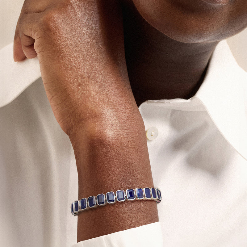 Sapphire bracelet on wrist: sterling silver with rectangular blue bezel-set stones