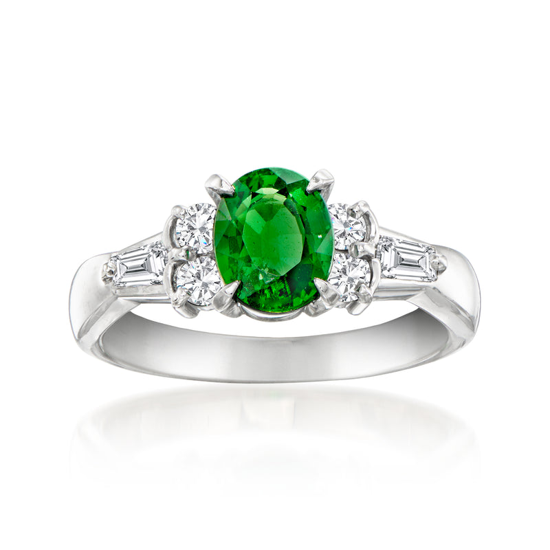 Platinum ring with oval green tsavorite center and diamond side stones