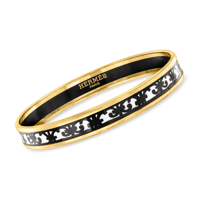 Yellow gold-plated bangle bracelet with black and white enamel pattern and Hermes logo