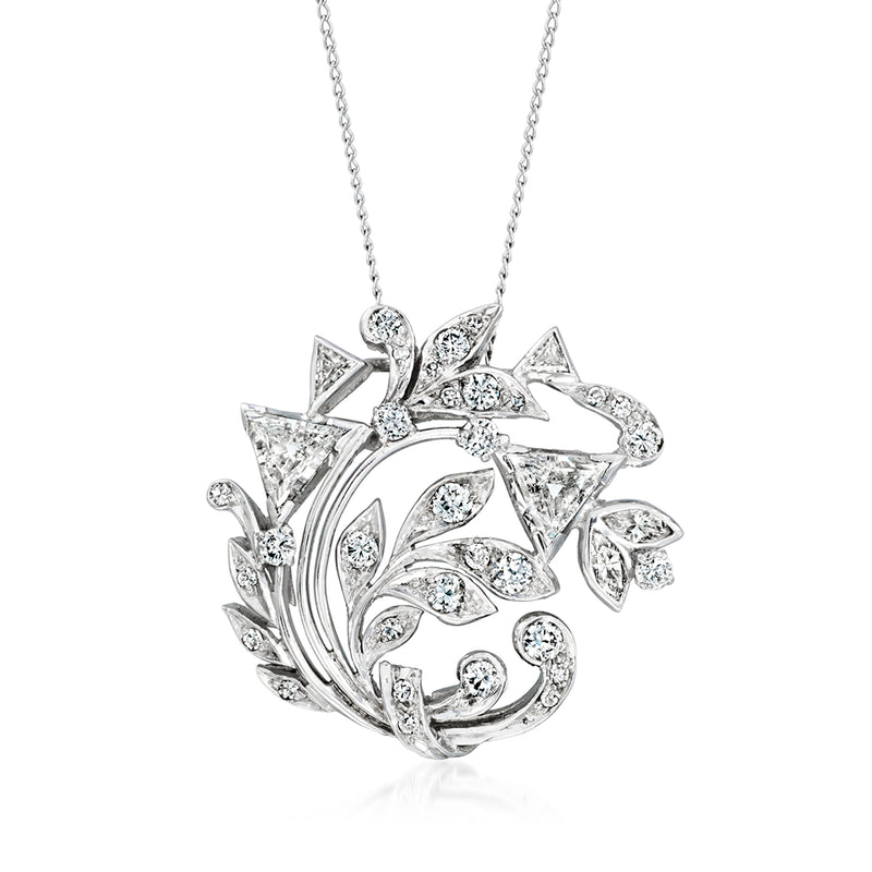 Platinum diamond floral necklace pendant with curved leaf motif, on a silver-toned chain.