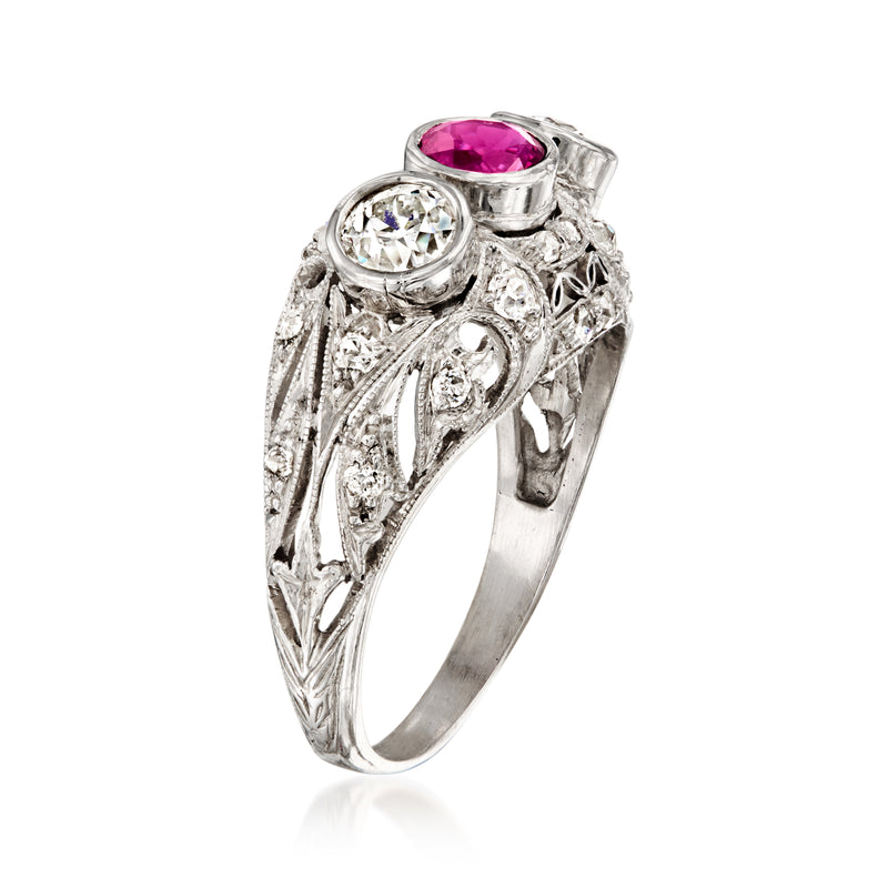 Platinum filigree dome ring with oval pink ruby and round diamond side stones