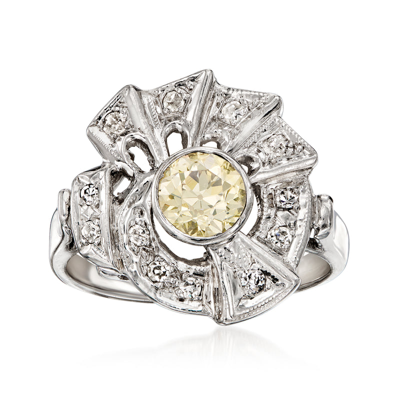 Vintage diamond swirl ring in 14kt white gold with yellow center stone and clear accents