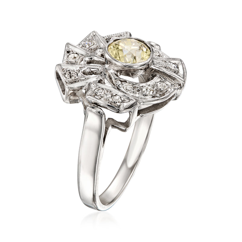 14kt white gold diamond swirl ring with oval yellow center stone and side prong details