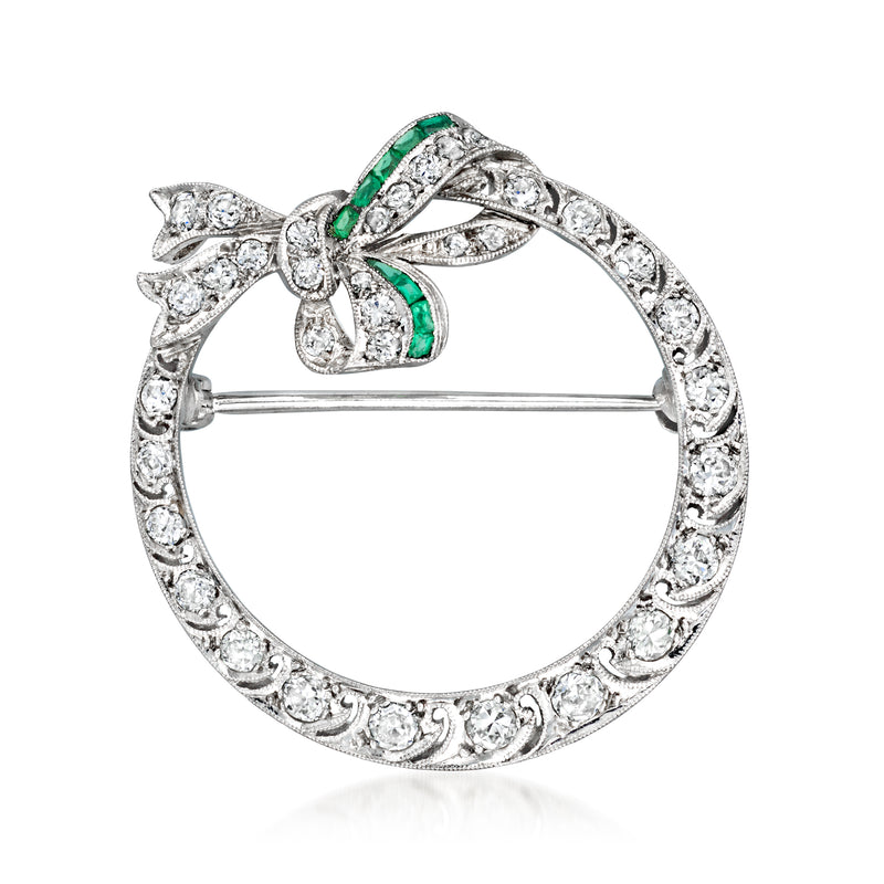 Round diamond filigree circle pin with green simulated stones and silver-toned frame