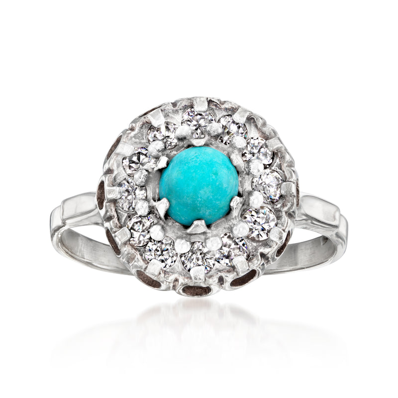 Sterling silver ring with round turquoise center and clear stone halo