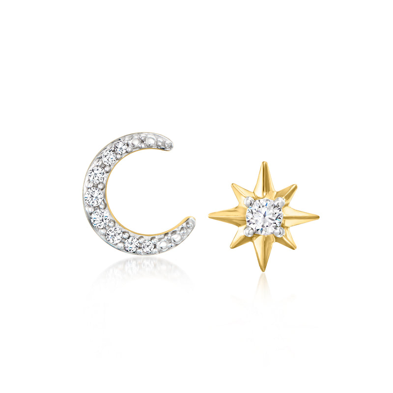 Mismatched moon and star stud earrings in gold with clear gemstone accents