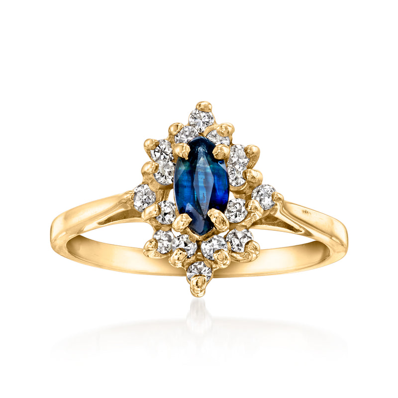 14kt yellow gold vintage sapphire and diamond cluster ring, oval blue center with side stones