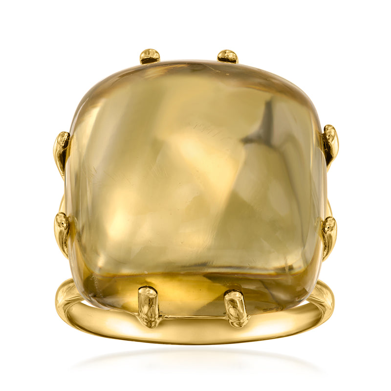 Citrine cocktail ring with large yellow gemstone dome and gold bezel prongs