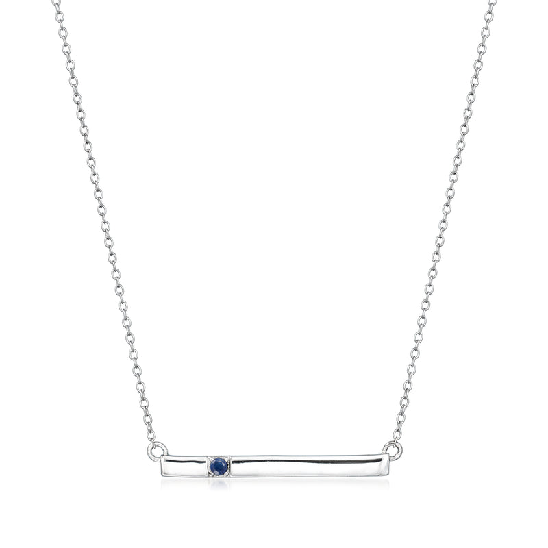 Sterling silver bar necklace with small blue sapphire set on a horizontal pendant