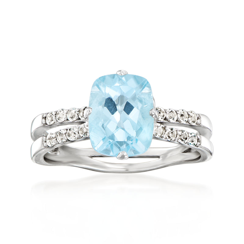 Sterling silver ring with large sky blue topaz center and small round white stones
