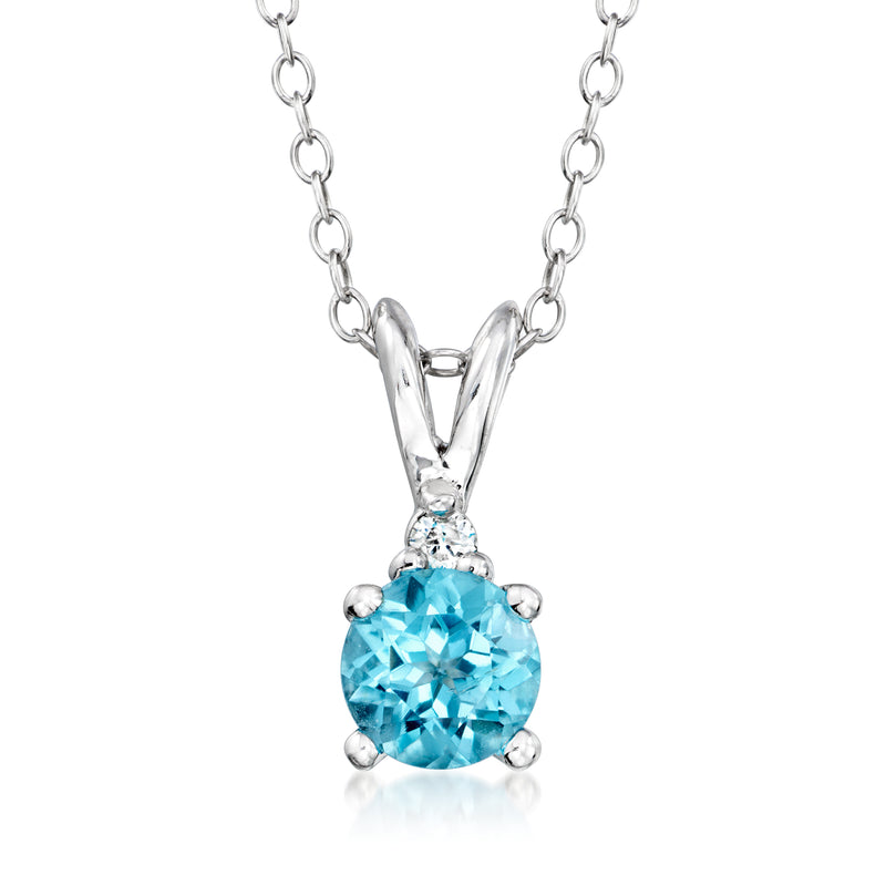 Sterling silver pendant necklace with blue topaz oval and small diamond accent