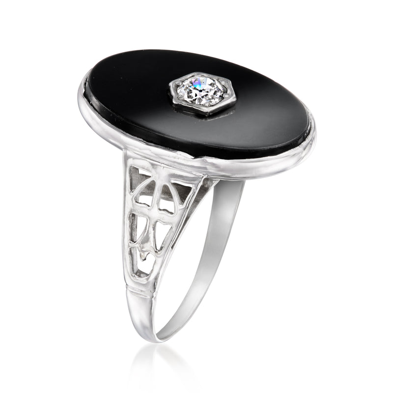 Vintage onyx and diamond ring with ornate openwork shoulders, oval black stone top