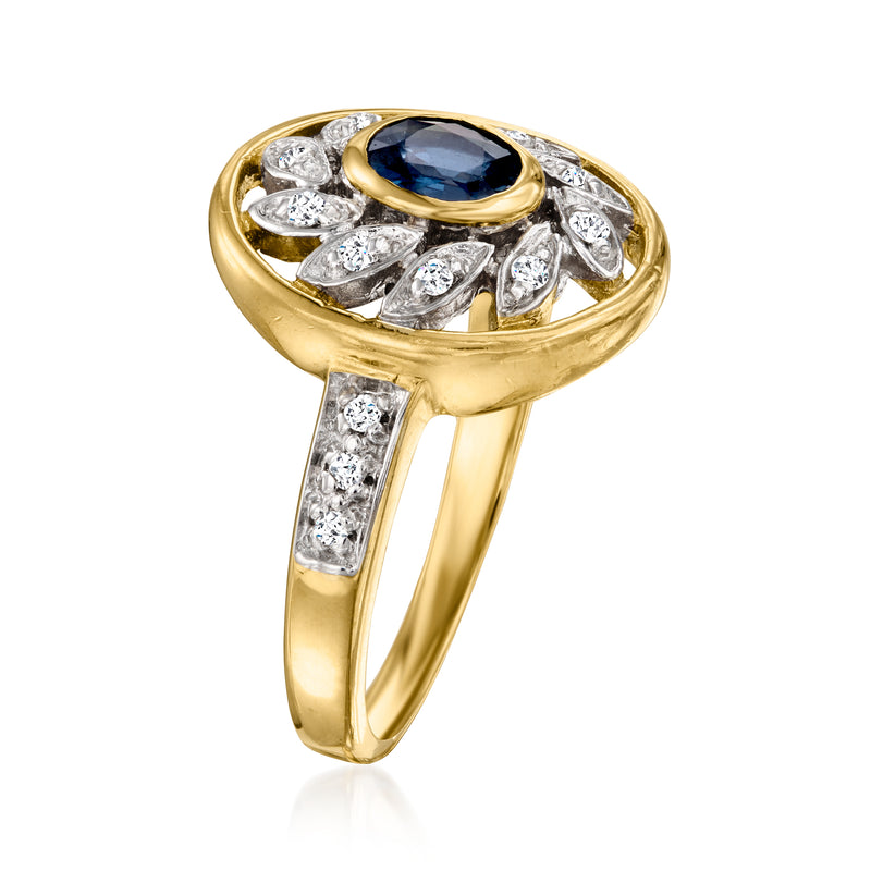 14kt yellow gold ring with oval blue center sapphire and marquise diamond accents
