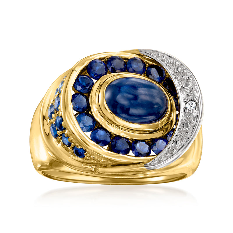 Vintage 14kt yellow gold ring with oval sapphire, blue sapphire halo, and diamond accent
