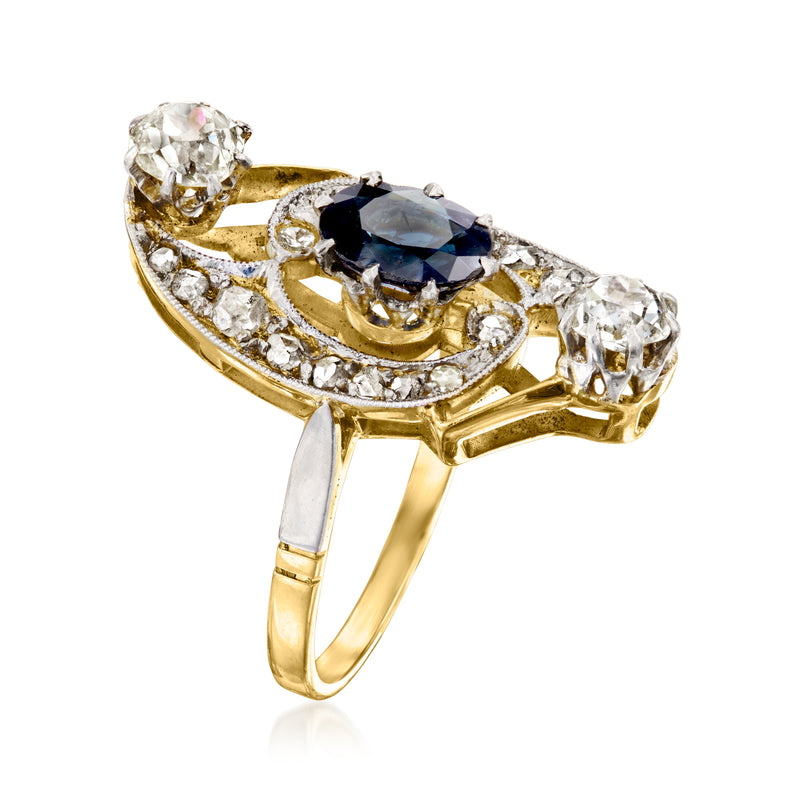 Oval blue sapphire ring with diamond accents; yellow gold band and openwork sides