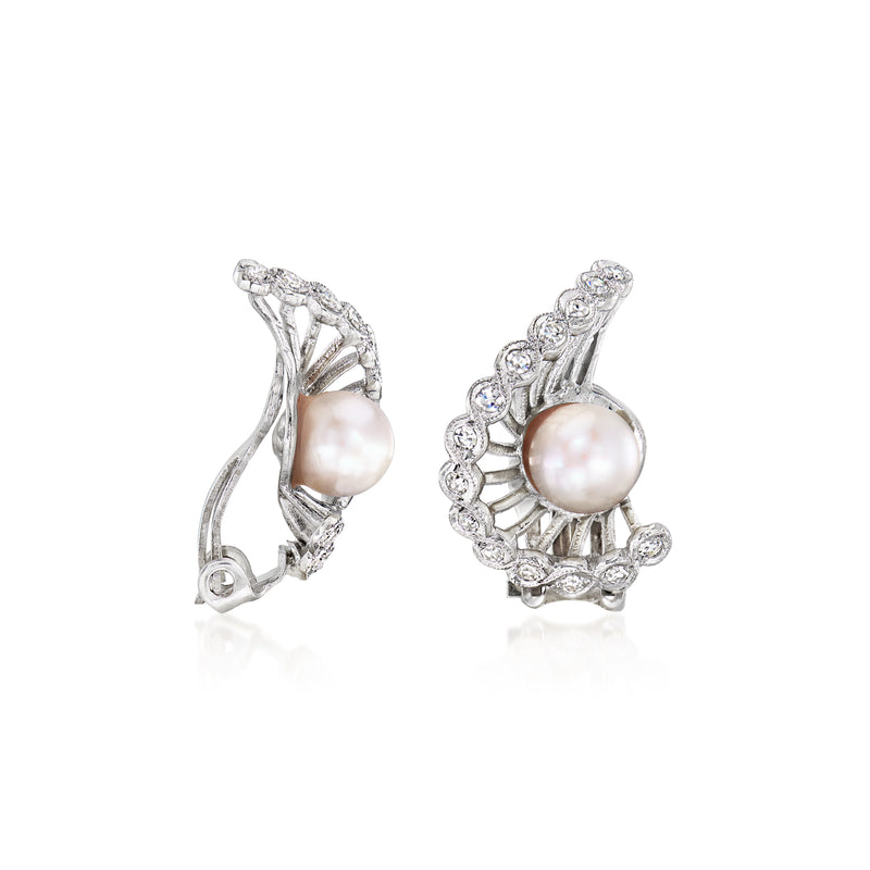 Back view of pearl and diamond swirl clip earrings in white gold, curved frame