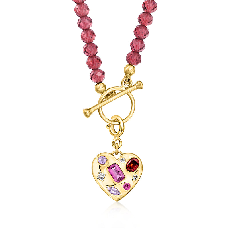 Gold heart charm pendant on a red beaded strand, featuring purple, red, and clear stones