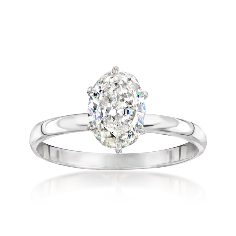 Diamond solitaire ring in white gold with oval center stone and four prongs