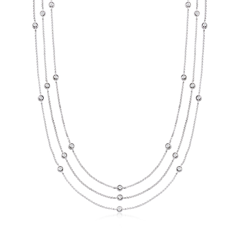 Three-strand diamond station necklace, round stones on 14kt white gold chains
