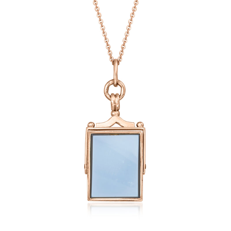 Rose gold swivel pendant necklace with rectangular blue stone in metal frame