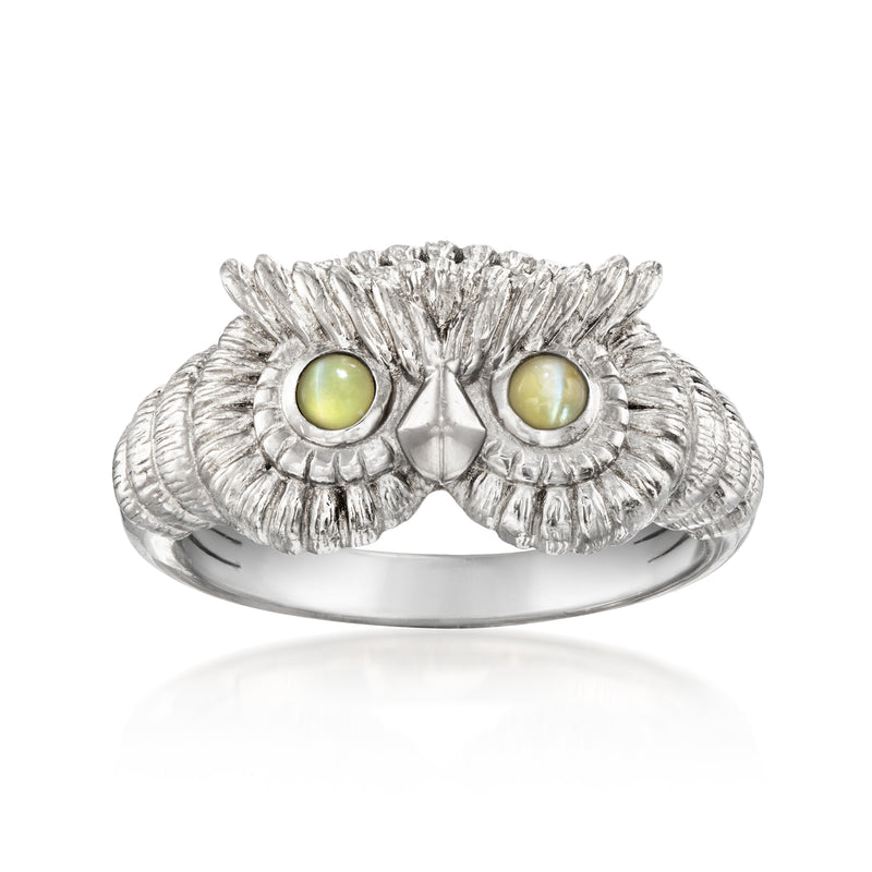 Platinum owl ring with two green cat’s-eye stones and textured feathered setting