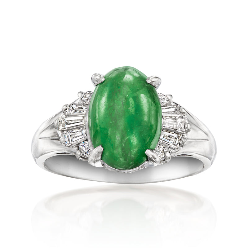 Platinum jade and diamond oval ring with green gemstone center and side baguette diamonds