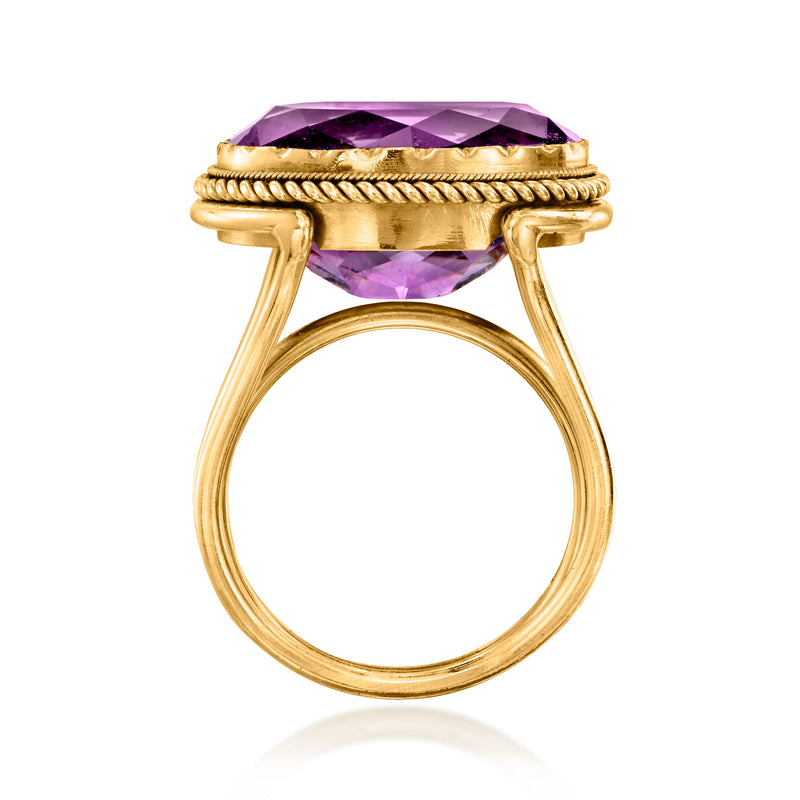 Oval amethyst cocktail ring in 18kt yellow gold, side view with raised prongs.