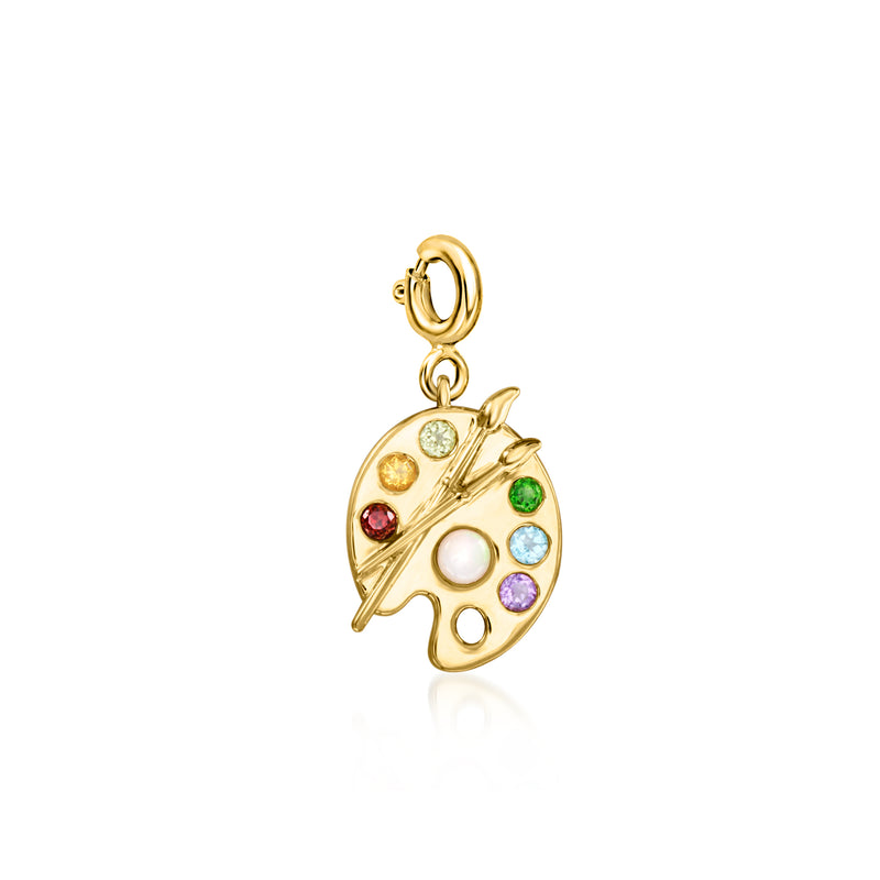 Gold painter's palette charm with opal-like center, pearl, and multicolor stones