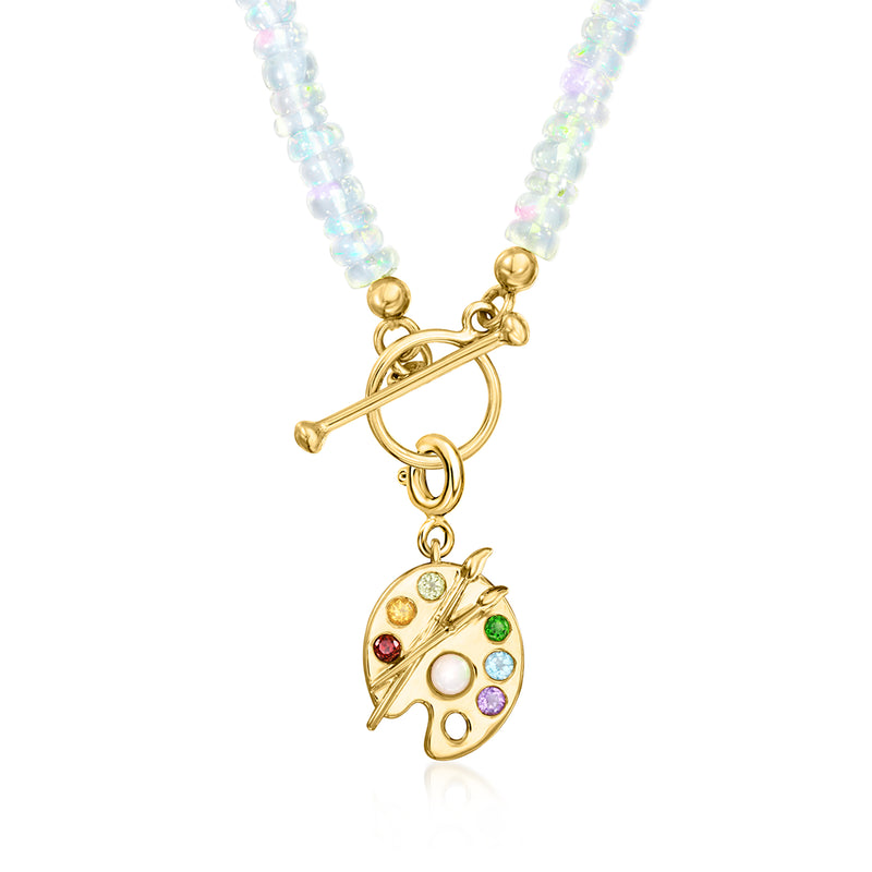 Painter's palette charm pendant with pearl and green/purple stones on blue beaded necklace