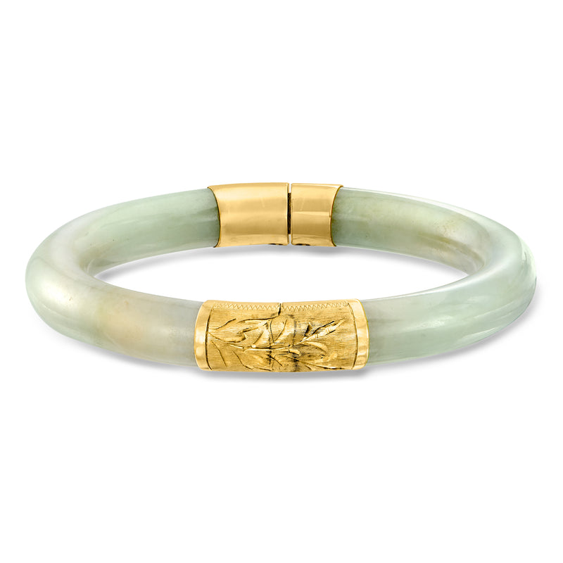 Carved jade bangle bracelet with 14kt yellow gold clasp, light green translucent band