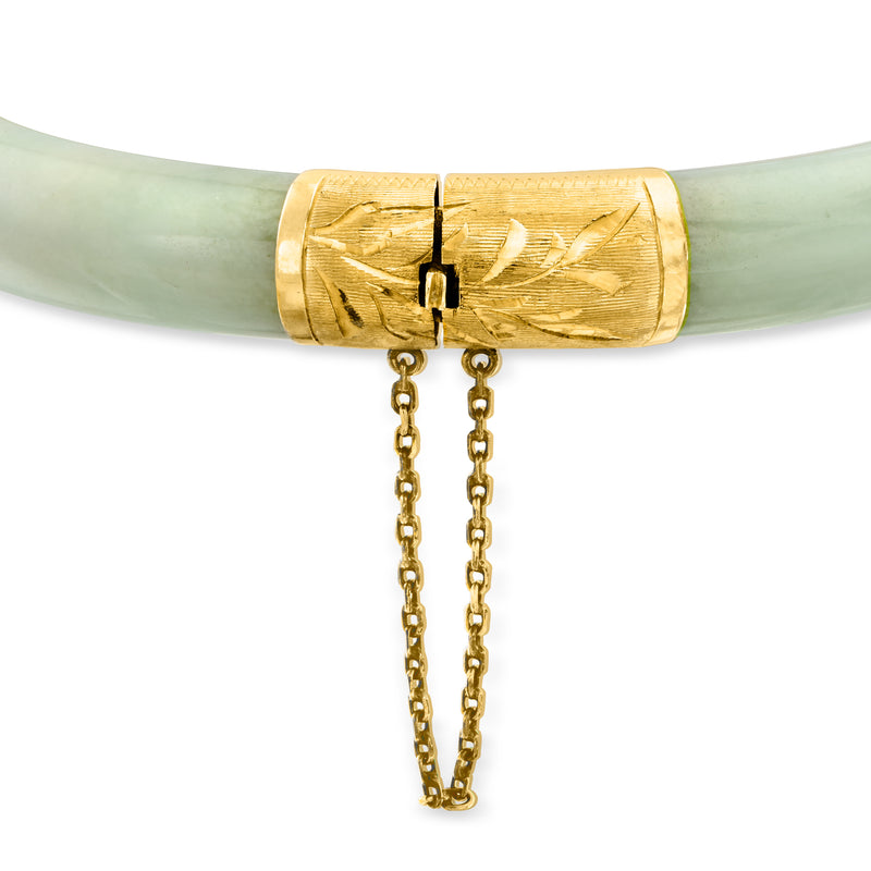 Carved jade bangle with engraved 14kt yellow gold center panel and dangling gold chains