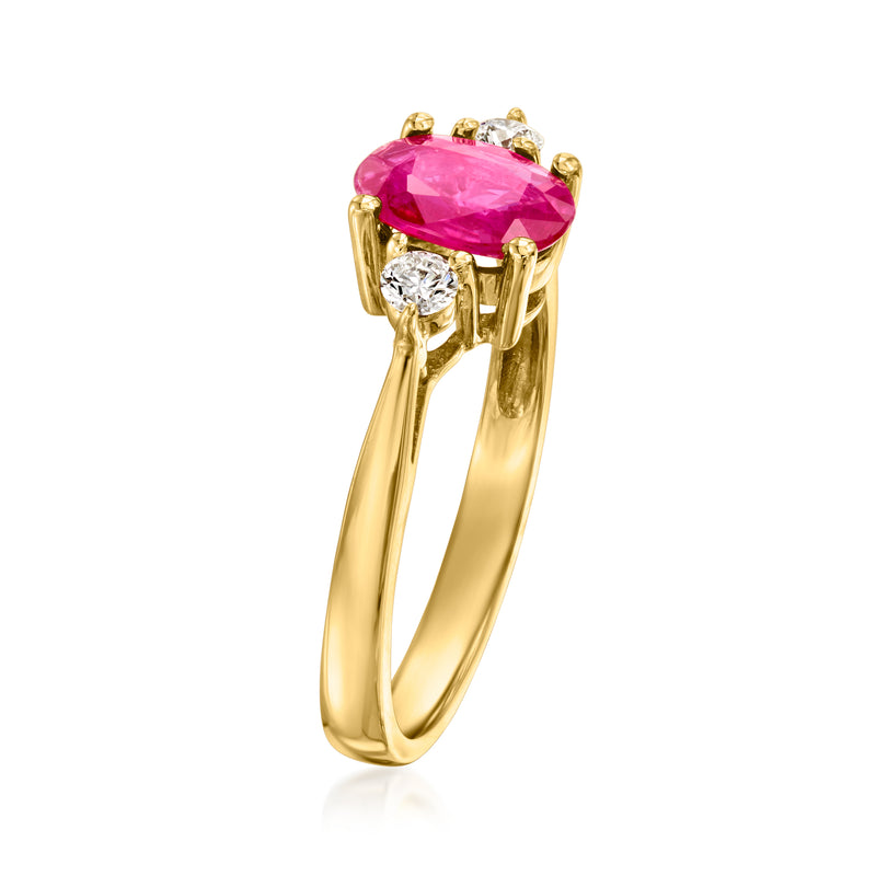 18kt yellow gold ring with oval ruby center and small diamond accents on shoulders