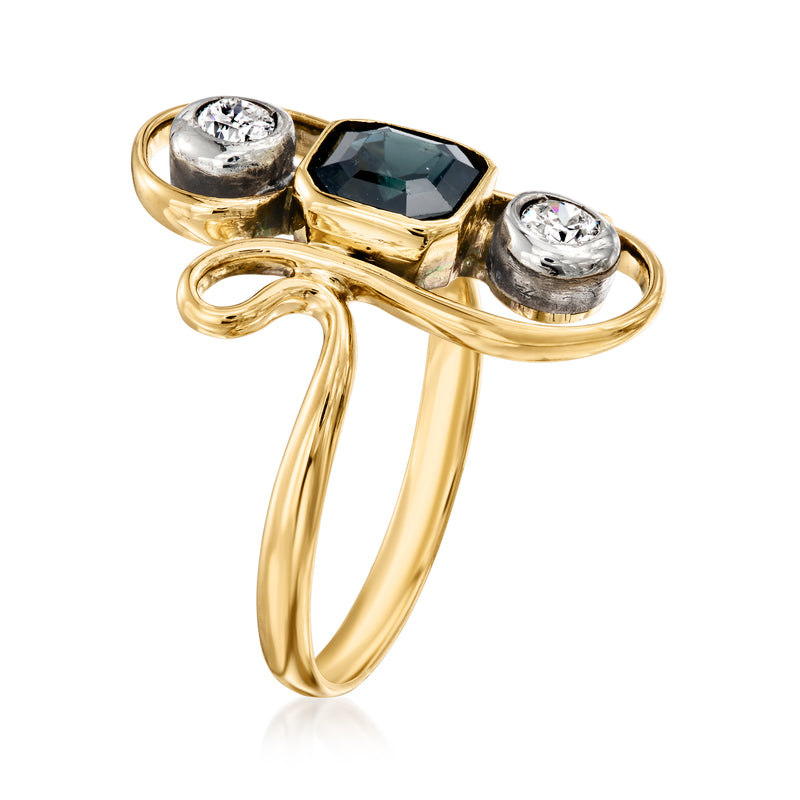 Vintage yellow gold ring with dark blue sapphire and three stone diamond accents, side view