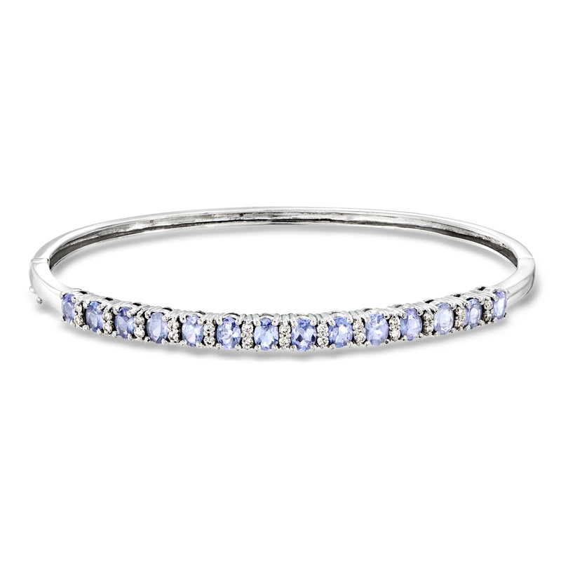 14kt white gold bangle bracelet with blue oval gemstone row and small diamond accents