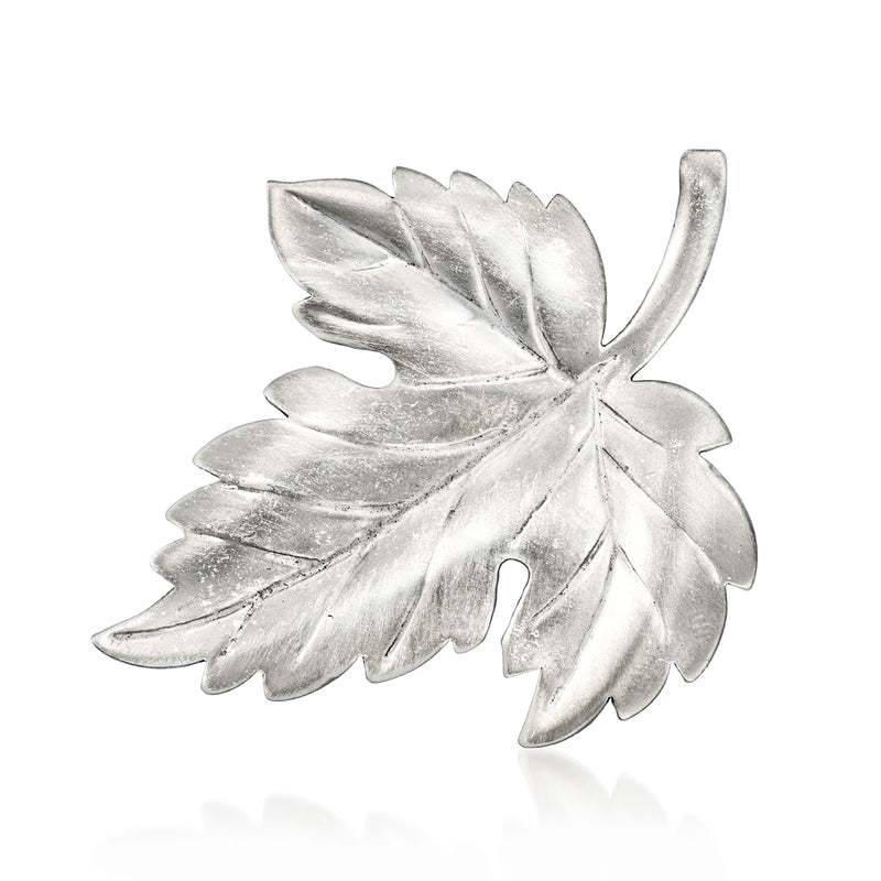 Sterling silver leaf pin with detailed layered leaf design and curved stem tip
