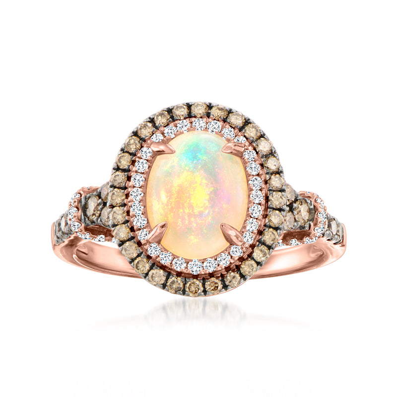 Rose gold ring with oval opal center and sparkling diamond halo, ornate side details.