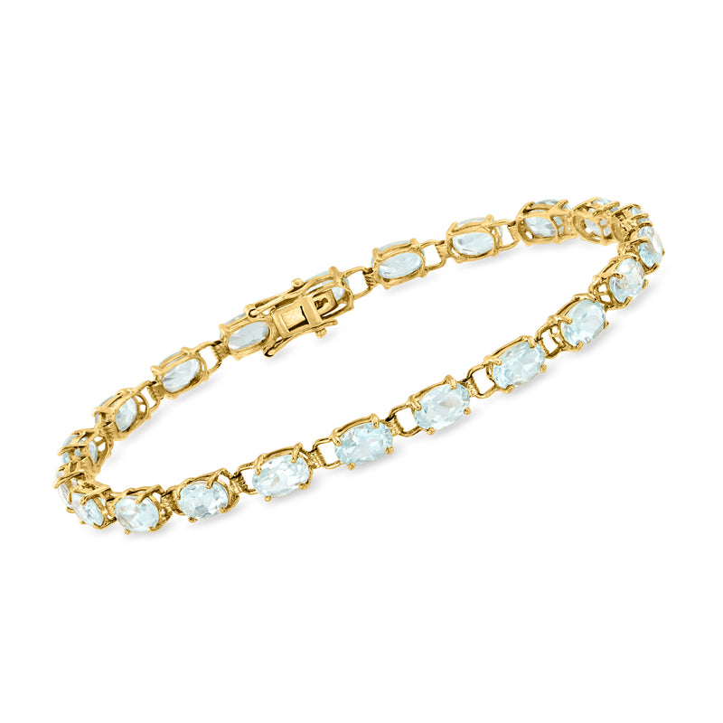 Vintage yellow gold bracelet with oval sky-blue topaz stones and hinged clasp