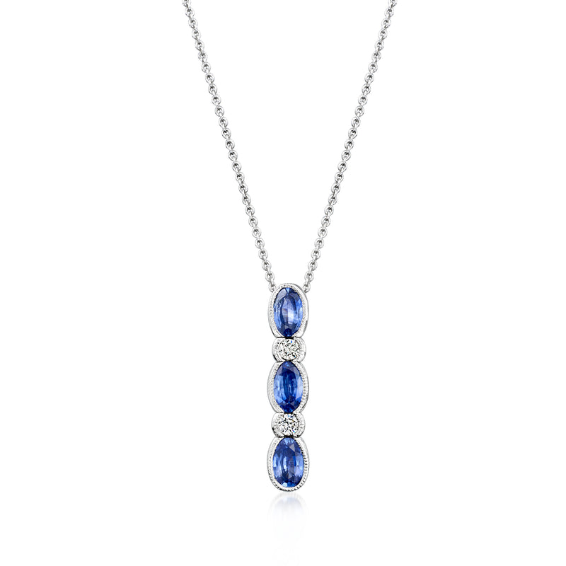 Pendant necklace with three oval blue sapphires and small clear diamond accents, chain