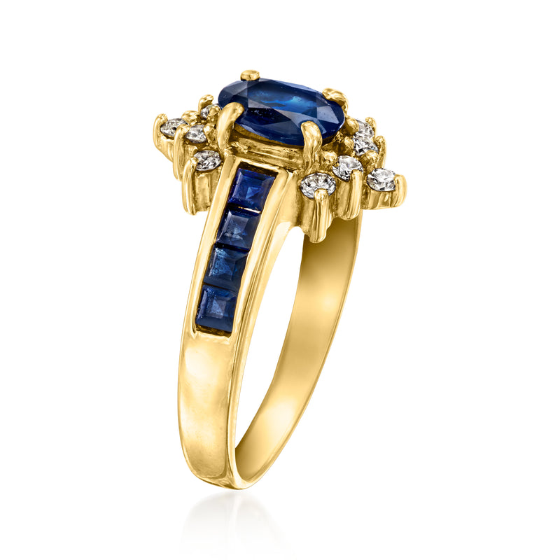Vintage sapphire ring with oval blue center, diamond accents, and yellow-gold side details