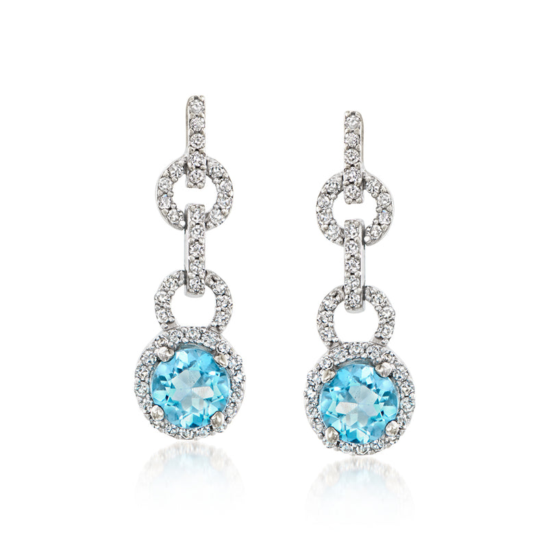 White gold drop earrings with round aquamarine blue gemstone and diamond halo accents