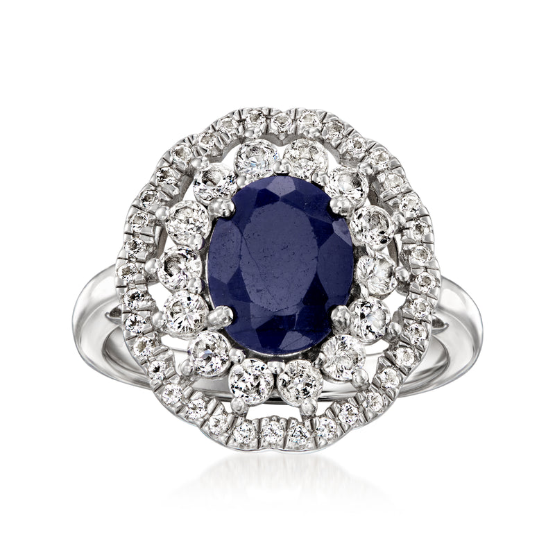 Oval blue sapphire ring in sterling silver with halo of clear white topaz