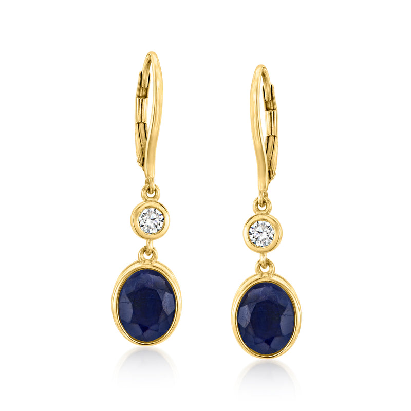 Gold leverback drop earrings with dark blue round sapphire and halo diamonds