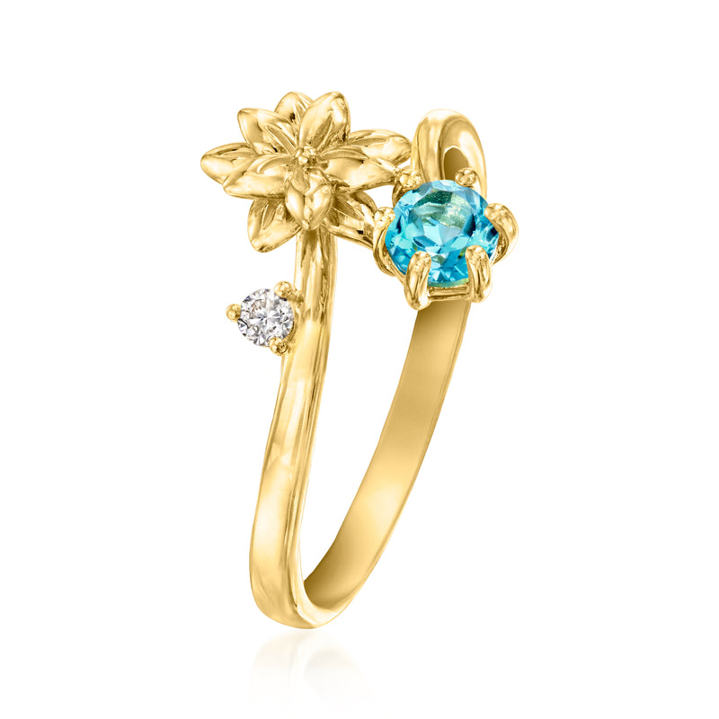 Poinsettia flower ring in gold tone with teal-blue oval center stone and side diamonds