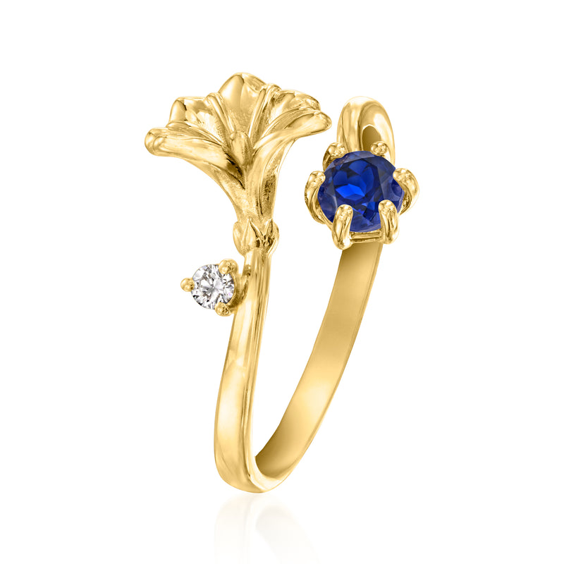 Gold-tone floral sapphire ring with blue center stone and two small diamond details
