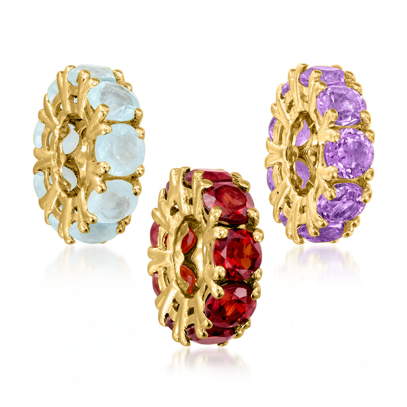 Three gold birthstone bead charms: light blue, red, and purple gemstones in floral frames