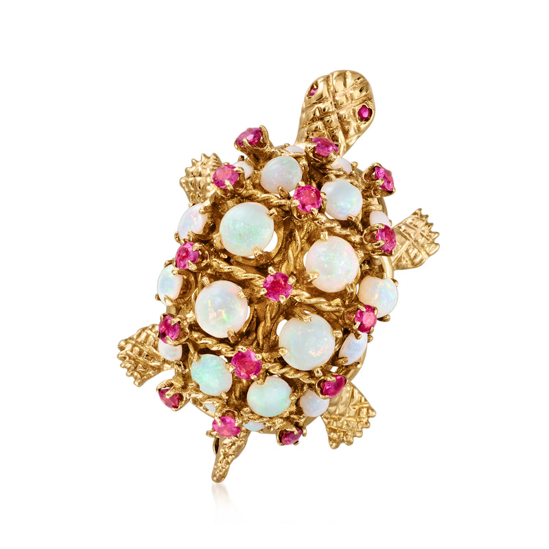 Turtle pin in 14kt yellow gold with opal-like white stones and pink ruby accents