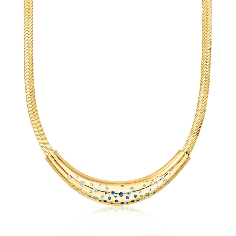 Yellow gold-plated herringbone necklace with blue and white simulated gemstones, arc centerpiece
