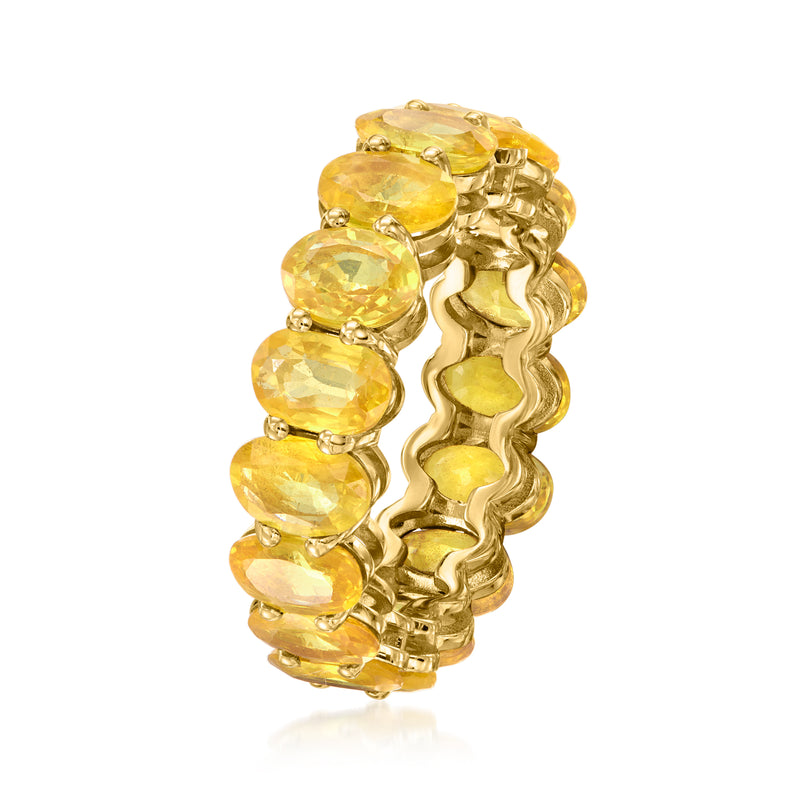 Side view of yellow gold eternity band with oval yellow sapphire gemstones